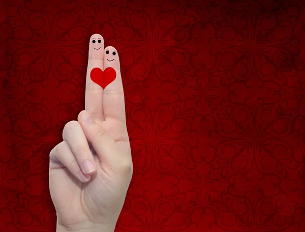 El parmakları ile ve bir kalp boyalı — Stok fotoğraf