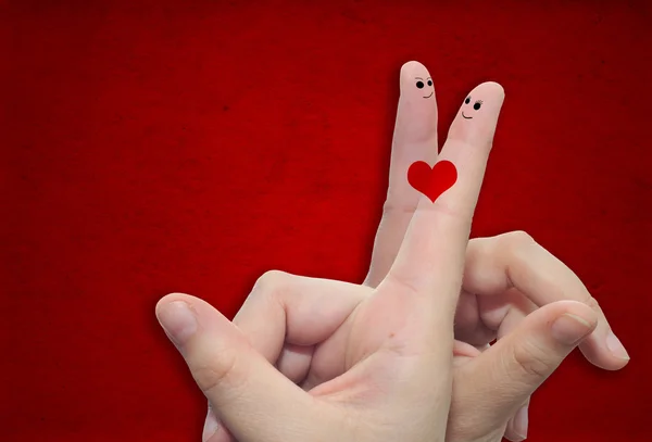 Twee handen met vingers en een hart geschilderd — Stockfoto