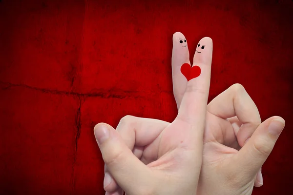 Hands with fingers and a heart painted — Stock Photo, Image