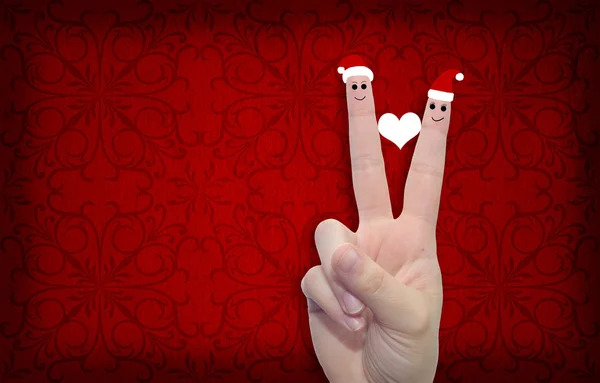 Finger verliebt in Weihnachtsmützen — Stockfoto