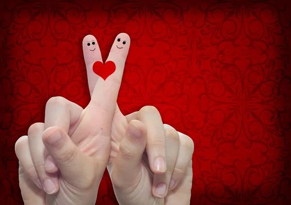 Finger und ein bemaltes Herz — Stockfoto