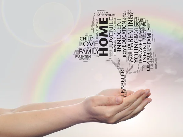 Concept or conceptual black home education text word cloud or tagcloud as a tree on man or woman hand on rainbow sky  background — Stockfoto