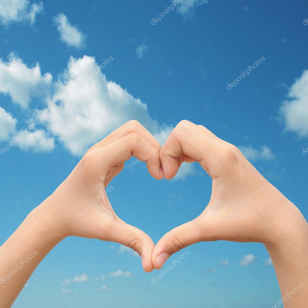 Valentines shape or symbol of heart over blue sky background Stock Photo by  ©design36 88930930