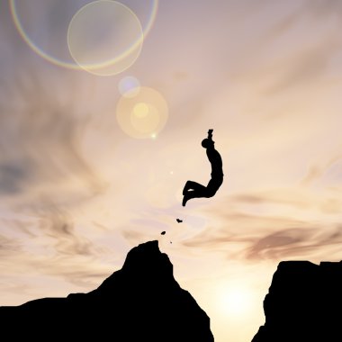 Kavram ya da kavramsal genç adam ya da işadamı siluet atlamak mutlu Uçurumun boşluğu gündoğumu veya günbatımı gökyüzü arka plan üzerinde