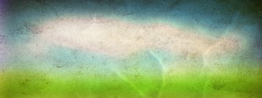 Kavram ya da kavramsal yeşil taze yaz veya bahar çim alanın üzerine mavi gökyüzü arka plan bir vintage eski kağıt afiş