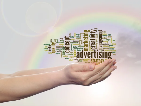 Concept of conceptuele abstracte business reclame en marketing word cloud of wordcloud in man of vrouw hand, regenboog hemelachtergrond — Stockfoto