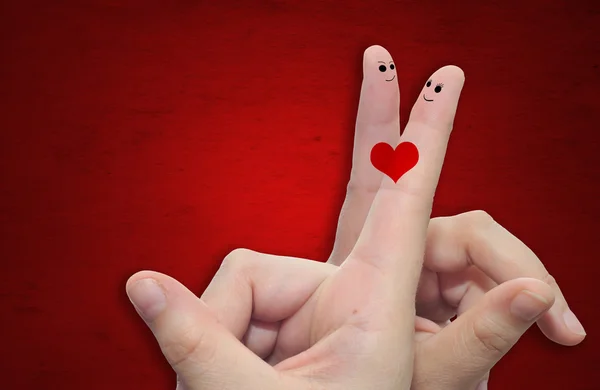 Parmak ve boyalı bir kalp — Stok fotoğraf