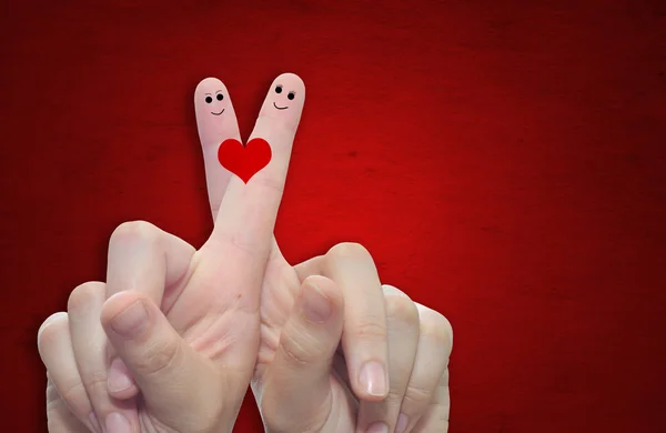 Fingers and a heart painted — Stock Photo, Image