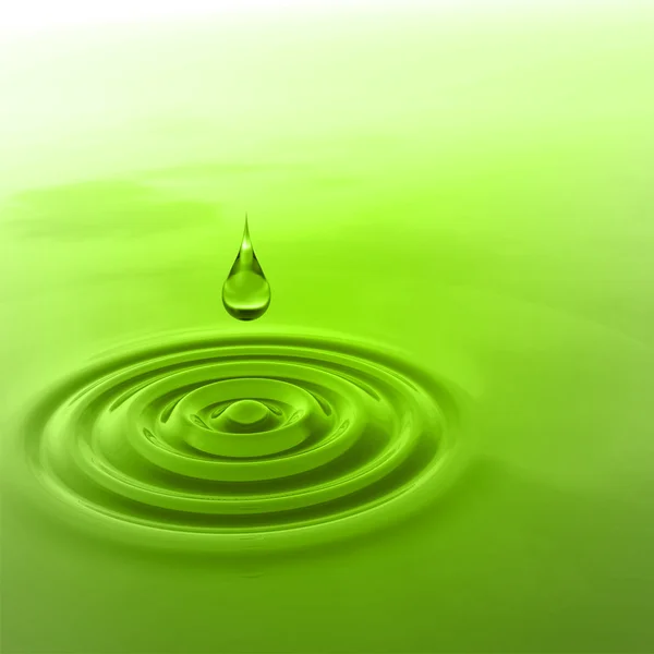 green liquid drop falling