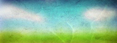 pring grass field over a blue sky