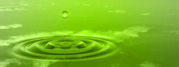 green liquid drop falling