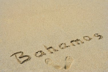onceptual el ya da kum Beach'te egzotik ada üzerinde el yazısı Bahamalar metinde