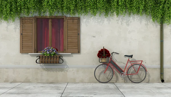 Maison de campagne avec fenêtre et vélo — Photo