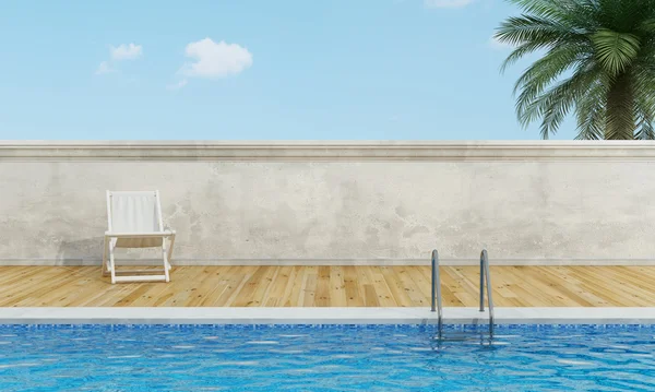 Swimming pool  with deckchair — Stock Photo, Image