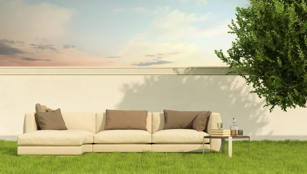 Elegant sofa in a garden — Stock Photo, Image