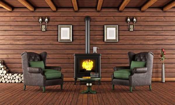 Wooden house with cast iron fireplace — Stock Photo, Image