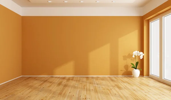 Leeres orangefarbenes Zimmer — Stockfoto