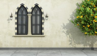 Old facade with mullioned gothic window  clipart