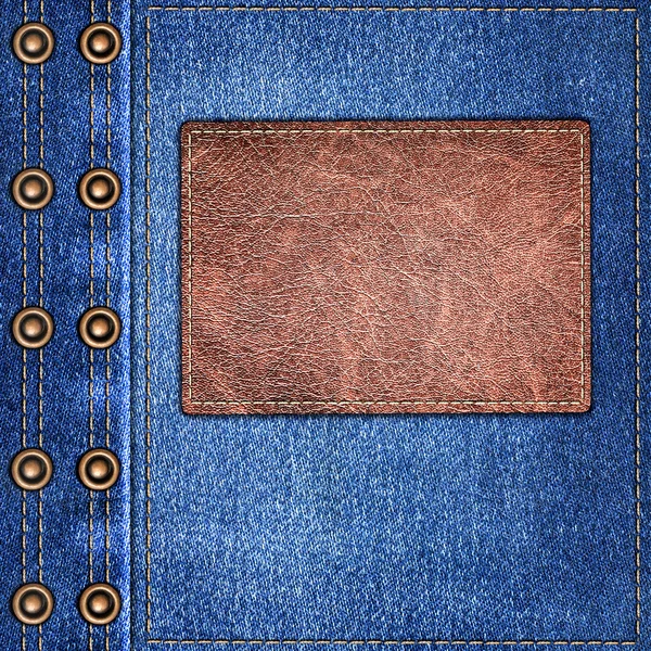 Background simple denim with leather label close-up — Stock Photo, Image