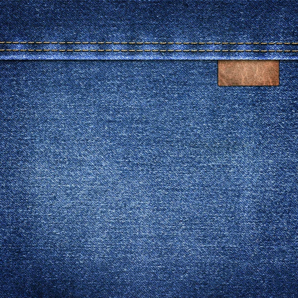 Fondo denim simple con etiqueta de cuero de cerca — Foto de Stock