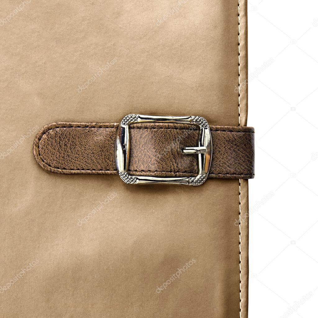 notebook closeup with buckle in the form of a leather strap