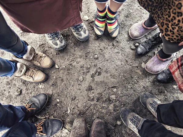 Feet of people standing in a circle — Stock Photo, Image