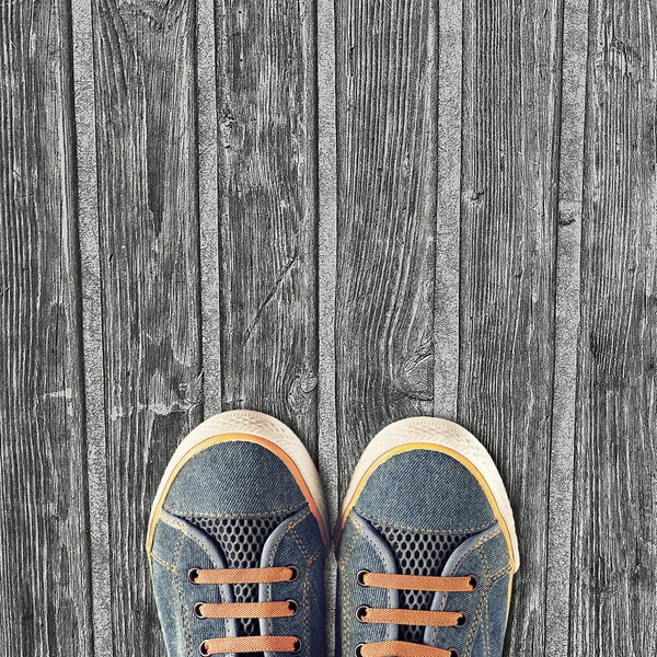 Hipster sneakers on a light wooden background — Stock Photo, Image