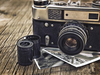 old vintage camera closeup on wooden background clipart