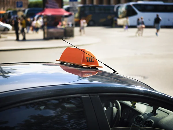 Taxi car waits for passengers near the bus station — Stock Photo, Image