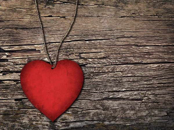 Red paper heart on a string on the wooden background — Stock Photo, Image