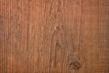 Arkaplan olarak koyu ahşap doku, kahverengi masa