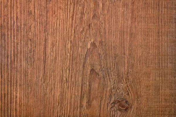 Arkaplan olarak koyu ahşap doku, kahverengi masa