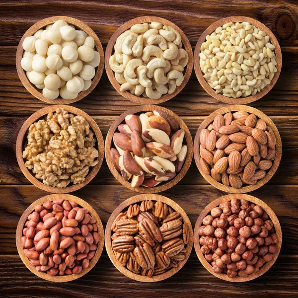 Various Nuts Wooden Bowls Top View Food Background Pecan Hazelnut — Stock Photo, Image