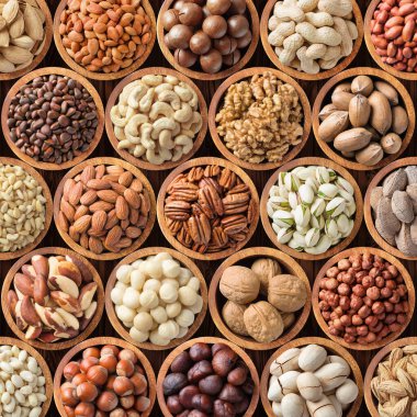 Çeşit çeşit fındık arka planı, atıştırmalık olarak çeşitli tohumlar