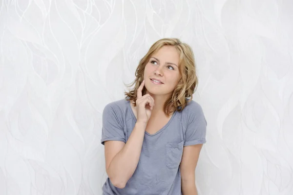 Young woman dreaming and smiling — Stock Photo, Image