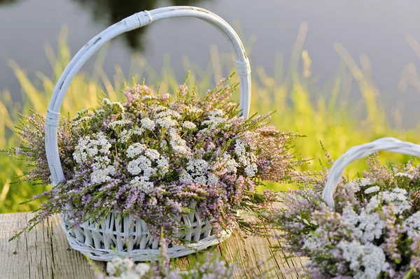 Bouquets of flowers in baskets — Stock Photo, Image