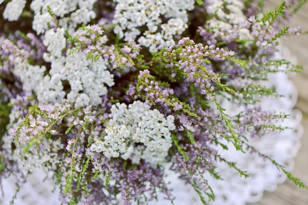 Bouquet of flowers in basket — Stock Photo, Image