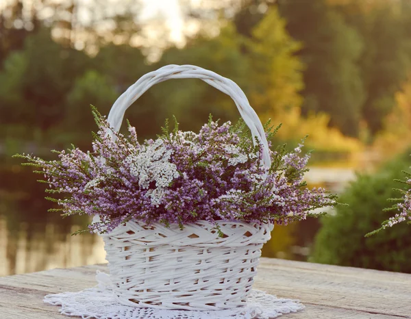 Bouquet of flowers in basket — Stock Photo, Image