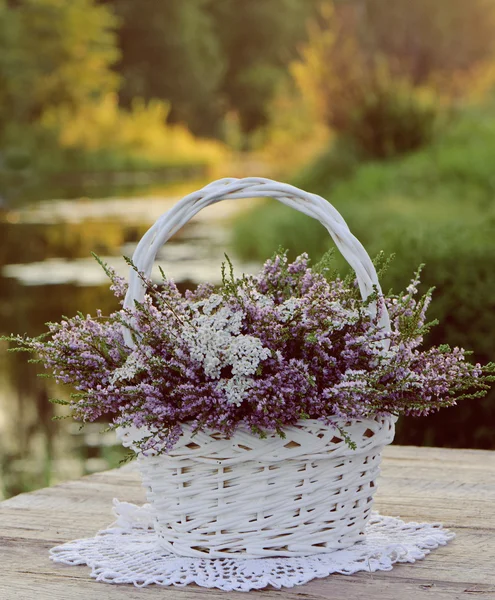 Bouquet of flowers in basket — Stock Photo, Image