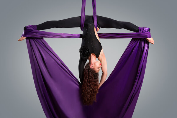 Beautiful dancer on aerial silk, aerial contortion, aerial ribbo