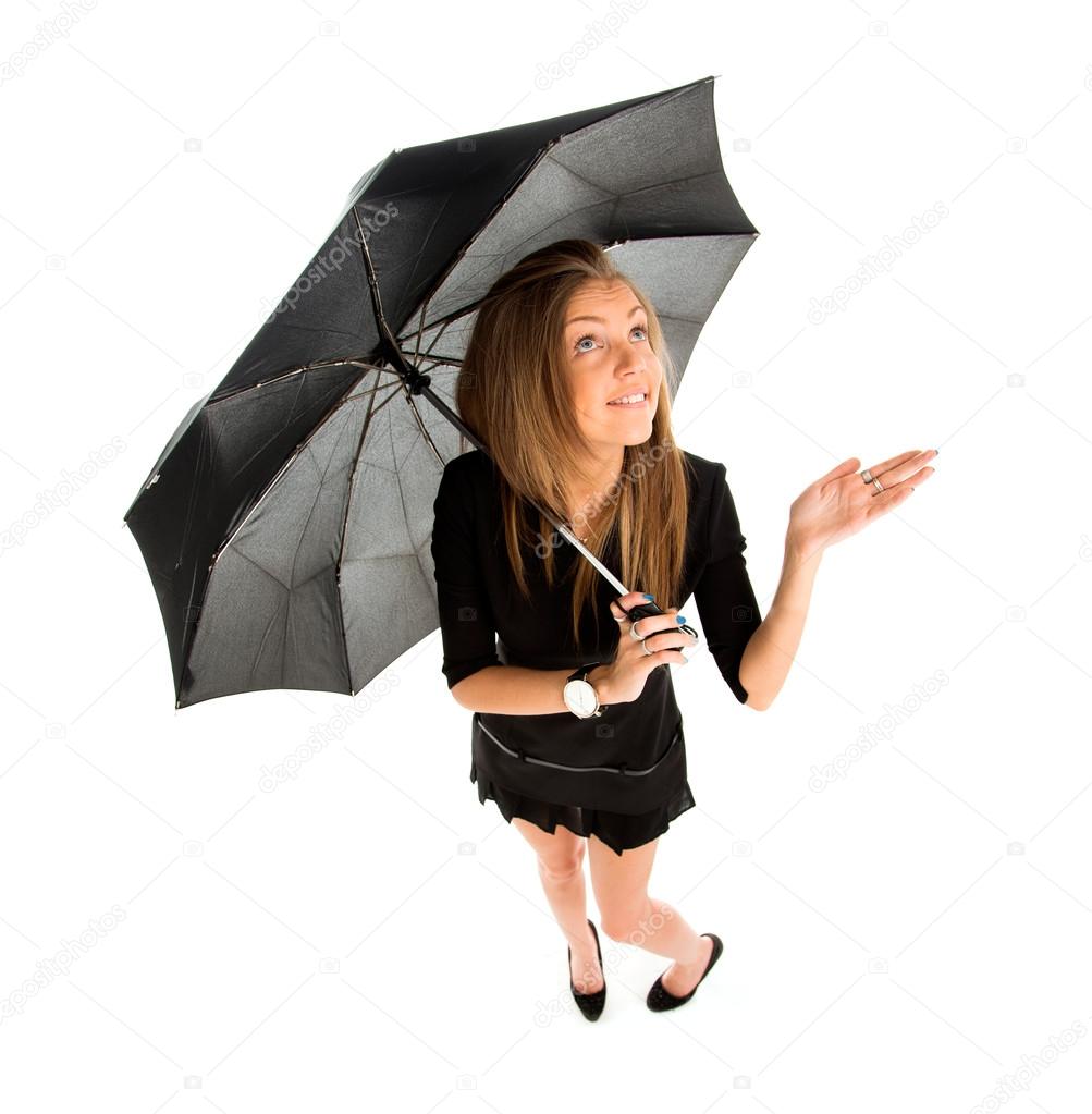 Young business woman checking if it's raining