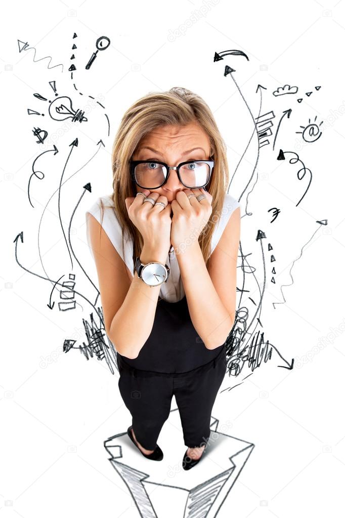 Frightened and stressed young business woman biting her fingers,