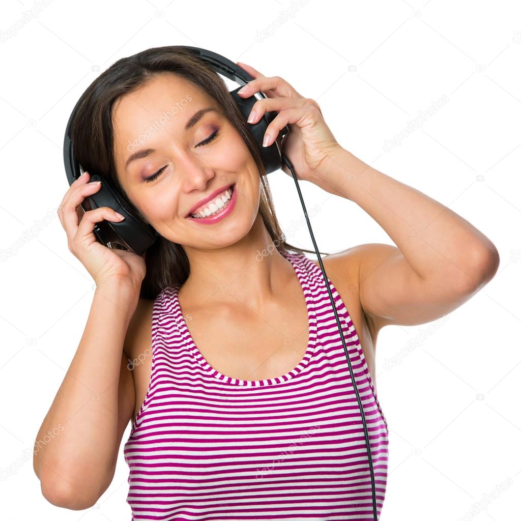 Young woman with headphones listening music .Music teenager girl