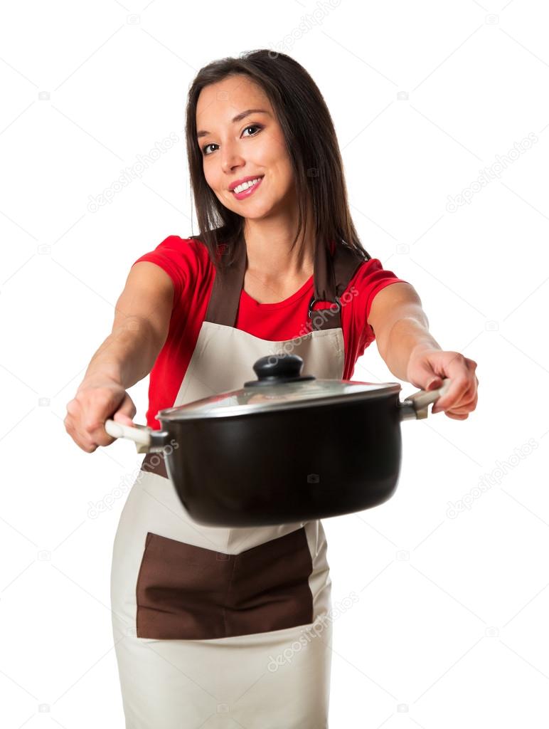 Beautiful brunette woman housewife holding pan. Studio shot over