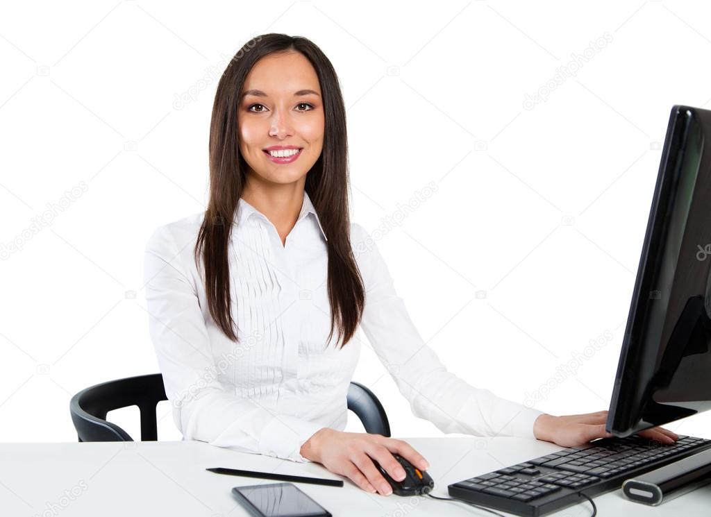 Portrait of a young business woman using computer at office