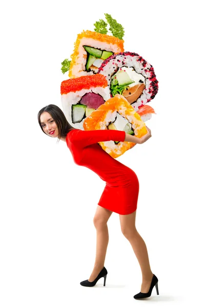Jeune belle femme porte sushi sur un fond blanc — Photo