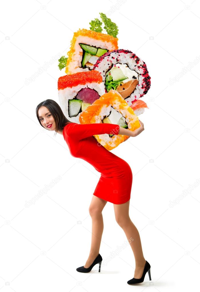 Young beautiful woman carries sushi on a white background