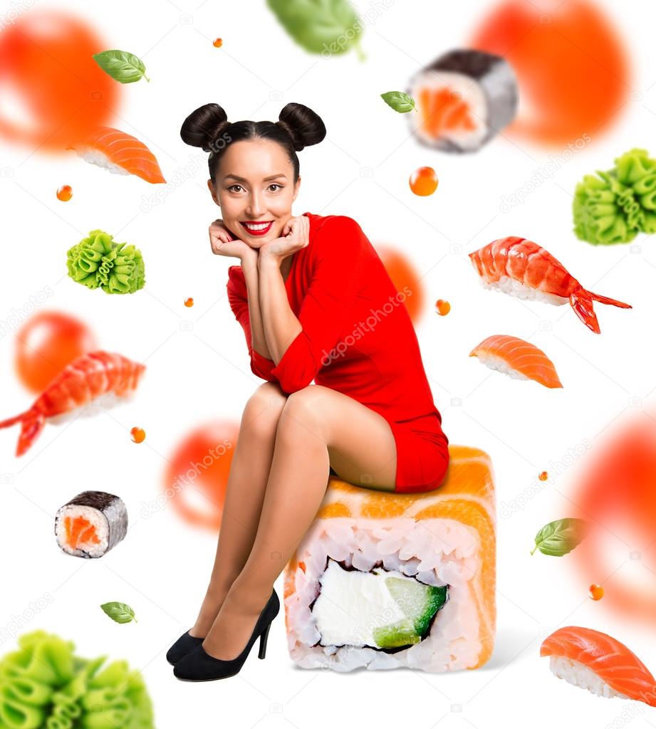 Young beautiful woman sitting on sushi, isolated on white