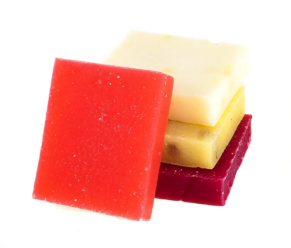 Multi-colored pieces of natural soap on a white background — Stock Photo, Image