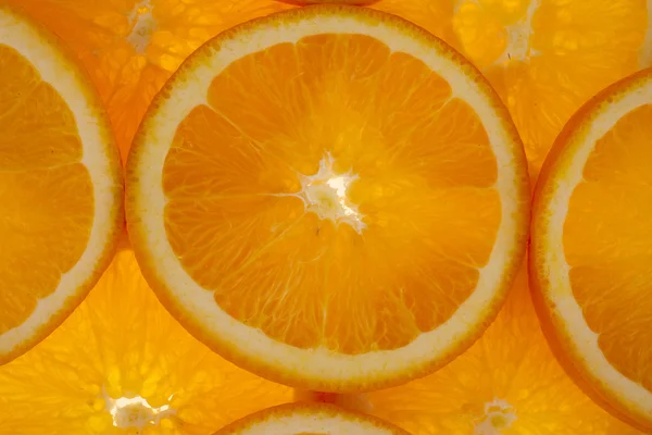 Tło: Plasterki pomarańczy — Zdjęcie stockowe